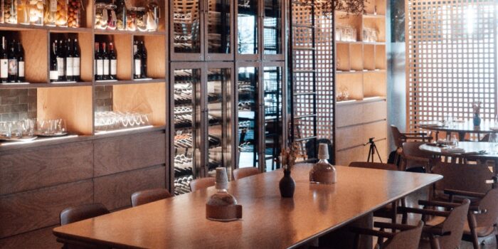 Interior of cellar door with seating in front of wine display units