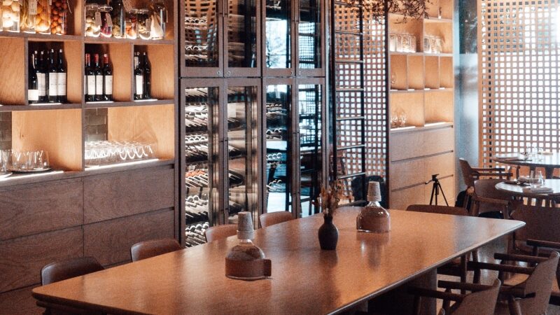 Interior of cellar door with seating in front of wine display units