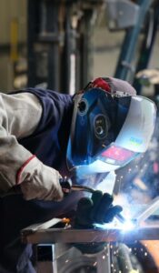 Egritech employee welding steel.