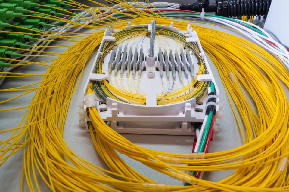 Coils of fibre optic cable leading into connections.