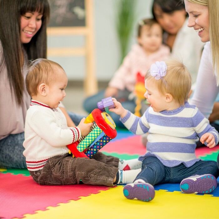 Young children in early childcare centre with carers